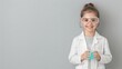 © K-MookPan - A child in a lab coat and goggles, excitedly holding a beaker with colorful liquid, with ample copy space for text or graphics. Commercial photography, Natural soft pale skin.