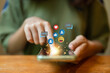 © Worranan - The concept of living on vacation and playing social media. Social media and digital online concept, man using smart phone with Social media. Social Distancing ,Working From Home concept.