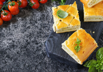 Wall Mural - homemade pie with meat and potatoes on a wooden board