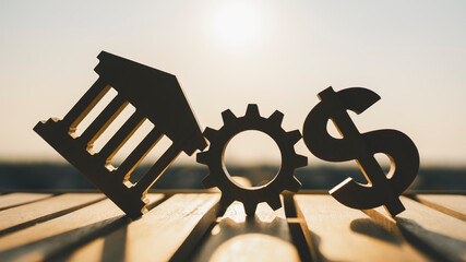 Wall Mural - Gear icon with bank symbols and dollar bills around it. It is a picture that has a concept about the risk in managing the financial system of the bank.