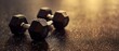 © Pornarun - Two dumbbells lying on a textured surface.