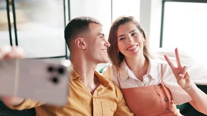 Poster - Selfie, happy and couple on sofa with smile for social media, profile picture and bonding. Dating, love and man and woman on couch take photo for website post, home and online for relationship