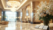 © Andrew - A grand hotel lobby with high ceilings, elegant chandeliers, and luxurious furnishings. The focus is on a sophisticated reception desk with a floral arrangement and a few brochures.