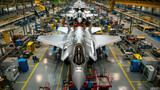 Futuristic airplanes being built at modern aerospace factory, military aircrafts are in assembly shop of plant. Concept of plane, industry, manufacturing, fighter, war