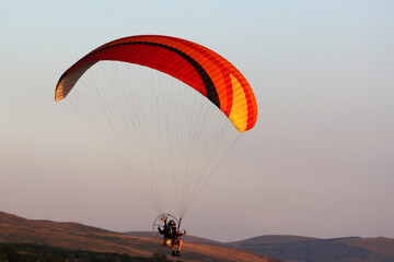 Poster - Paramotor pilot coming in to land	