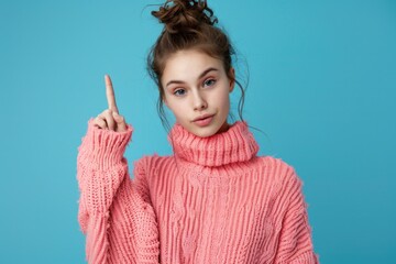 Poster - A woman wearing a pink sweater points upwards, possibly indicating direction or excitement