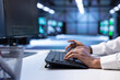 © DC Studio - Programmer typing on keyboard, optimizing data center performance and capacity using computer. Close up of IT expert troubleshooting mainframes to ensure optimal performance and minimize downtime
