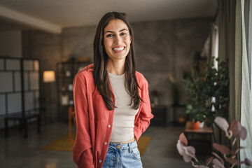 Portrait of beautiful adult young women stand and smile at home