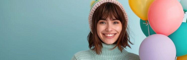 Wall Mural - Colorful Balloons With Smiling Faces Against a Light Blue Wall