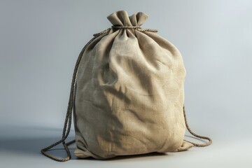 Poster - A simple drawstring bag resting on a clean white surface, suitable for still life photography or product displays
