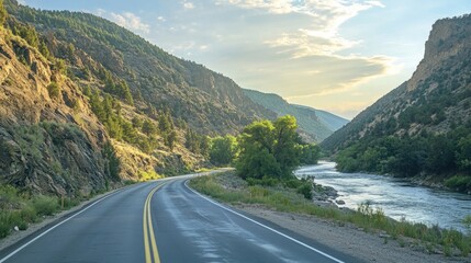 Wall Mural - Scenic roadside view of a mountain highway with a river running alongside