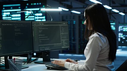 Poster - Portrait of smiling engineer overseeing data center, making improvements and updates to ensure system can handle networking tasks. Upbeat server room worker tracking network traffic, camera A