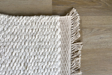 Wall Mural - White woven rug with fringe detail, top view