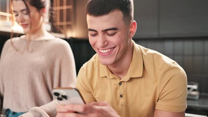 Poster - Phone, couple and happy man laugh in kitchen while cooking lunch together with woman. Mobile, scroll and reading funny meme on social media app, comedy and dinner blog for recipe on internet in home