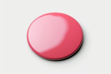 Poster - A small pink button resting on a clean white surface