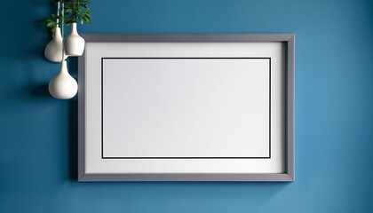 Wall Mural - empty photo frame mockup hanging on blue wall background