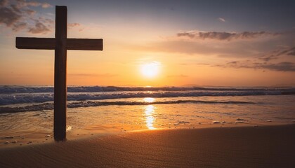 Wall Mural - spiritual beach scene with weathered wooden cross silhouetted against dramatic sunset ocean waves gently lapping shoreline