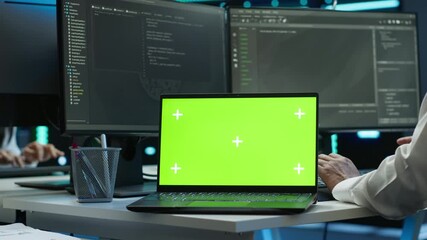 Poster - system administrator in data center installing software on isolated screen laptop, troubleshooting i