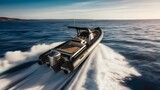 A luxurious rigid inflatable boat speeding across the sea with a powerful engine.