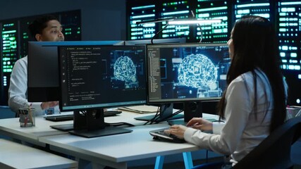 Wall Mural - Team of engineers using AI tech on computer to do checkup in server room. Data center workers using artificial intelligence technology to process datasets for training, camera A