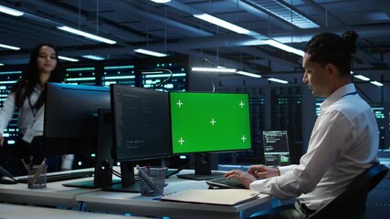 Poster - system administrator overseeing data center using green screen computer, ensuring system can handle 