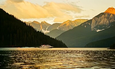 Sticker - The scene begins with a close-up of the water taxi's bow cutting through the water, then pulls back to reveal the full expanse of the mountain lake and the surrounding landscape.