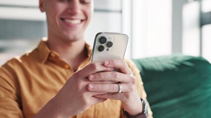 Poster - Happy, online and man with phone on sofa for social media, communication and networking. Relax, home and hands of person on smartphone for chatting, browse website and internet dating in living room