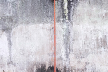 Poster - Rusty steel line in the middle of concrete wall with cracked peeling paint texture abstract on background