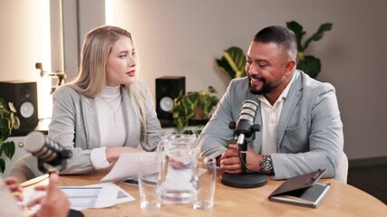 Fototapete - Podcast, interview and people with paper in discussion for talk show, recording and celebrity news update. Broadcast, info and host with mic at desk for live streaming, meeting and content creation