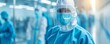 © Boontharika - Healthcare workers in full protective gear in a hospital setting. They are focused and ready to provide medical care during the pandemic.