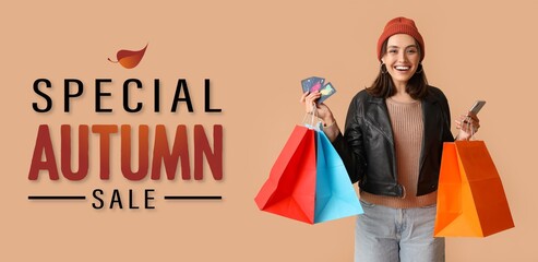 Wall Mural - Banner for autumn sale with with young woman holding mobile phone, shopping bags and credit cards