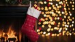 © THESUN - Red Christmas stocking filled with festive gifts hangs from fireplace mantel