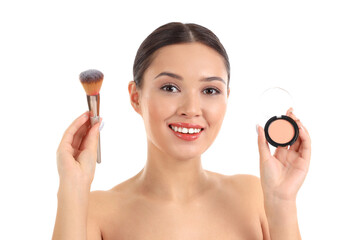 Wall Mural - Young Asian woman with makeup brush and powder on white background, closeup