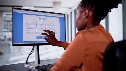 Wall Mural - African Woman Filling Online Survey Form On Laptop Computer