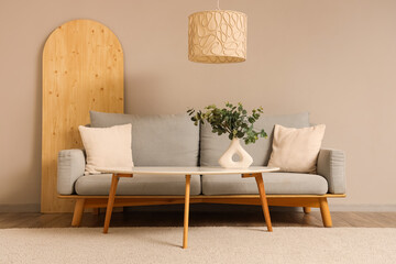 Wall Mural - Interior of living room with eucalyptus in vase and sofa