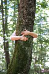 Woman hug the tree with love