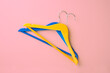 © TSViPhoto - Wooden clothes hanger on isolated background.