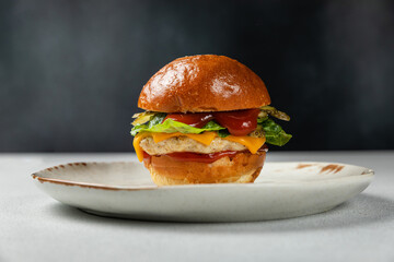 Poster - A delicious hamburger on a dark background.