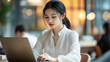 © Olexandr - Asian woman in white blouse works in the office