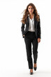 © pattozher - full body shot of female executive walking isolated on white backdrop