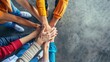 © Narongsak - A group of people are holding hands in a circle. The people are wearing different colored shirts and shoes. Scene is one of unity and togetherness