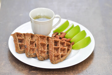 Wall Mural - waffle with apple and tea or riceberry waffle , Chocolate Banana Whole Wheat Waffle and almond