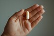 © miss_fortuna - A hand holding a pill. Generative AI
