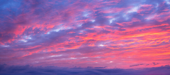 Wall Mural - Panorama of Beautiful Sky with clouds glowing at sunset for sky replacement