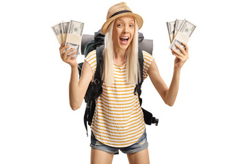 Wall Mural - Happy female tourist with a backpack holding money