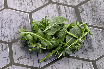 Wall Mural - Green Arugula heap over background