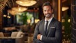 © CStock - Smiling businessman in a luxury hotel lobby