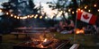 © Larisa - Evening barbeque with sparkling fire, Canada flag, and festive l