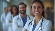 © Attasit - Happy doctors and nurses, united in teamwork, posing for a group portrait in a hospital, reflecting their commitment to patient care and healthcare success