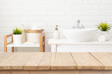 Wall Mural - table top from wooden planks for product display in blurred spa bathroom interior background
